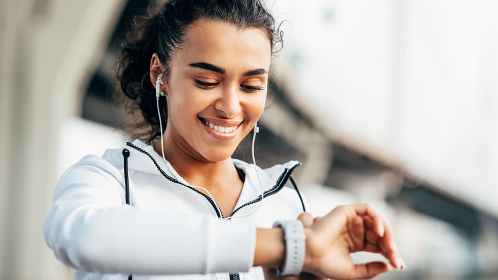 woman checking fitness tracker