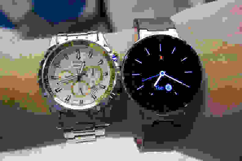 The OneTouch Watch next to an analog watch