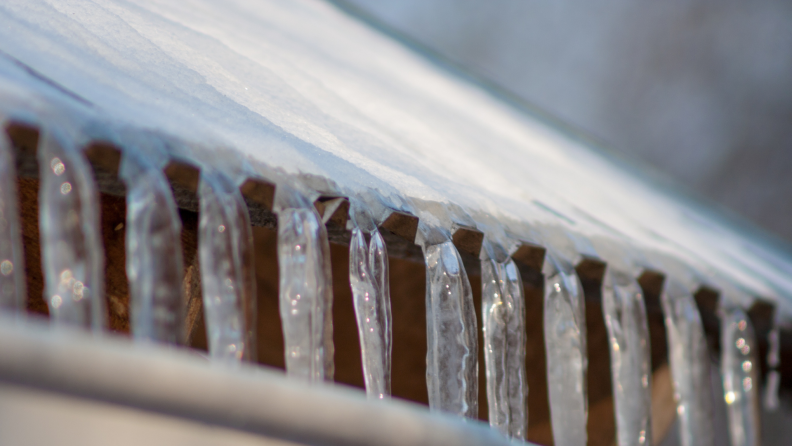 An ice dam is a thick layer of ice that forms on your roof, usually along the edge or in valleys, when melting water isn’t able to drain away and refreezes.