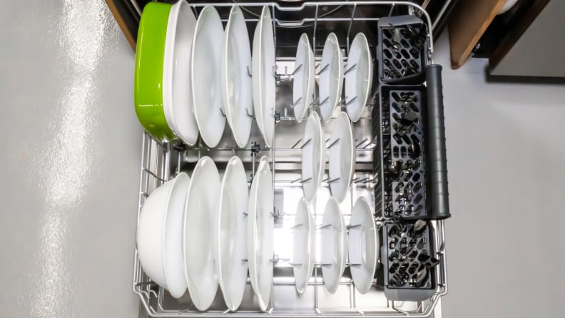 The Vinotemp Brama BR-DWSH01-S dishwasher's lower rack, pulled out and resting on its open door. The lower rack is full of evenly-spaced dishes.