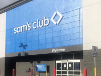 A Sam's Club storefront with a blue and white exterior, featuring the store's logo and entrance.