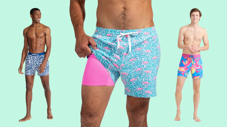 Three men's swimsuits: One in a blue and white print, one in flamingo print with a pink lining, and one in a multicolored pink print.