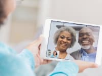 Girl video chatting with grandparents