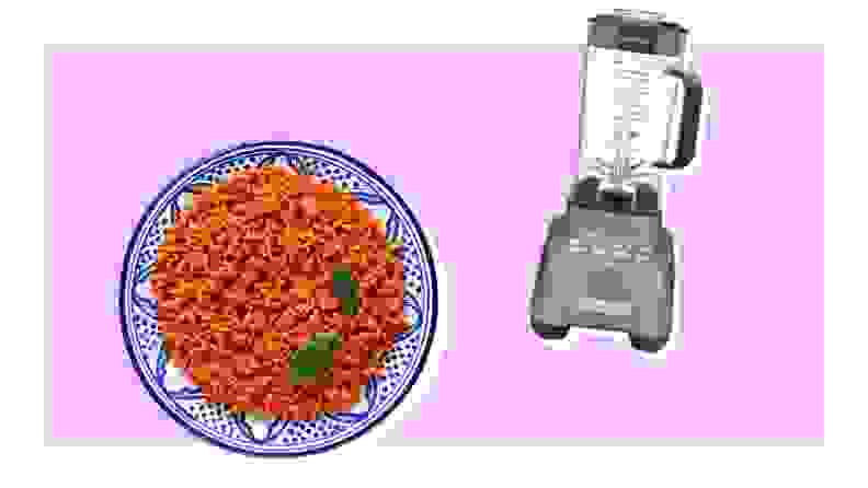 Dish of jollof rice and Cuisinart blender on purple backgorund