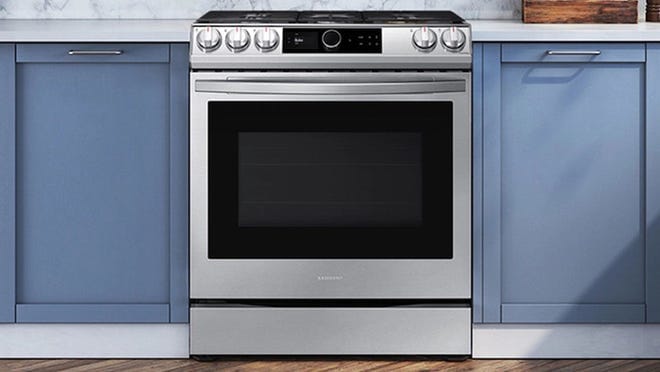 Stainless steel gas range in kitchen.