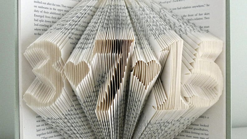 A personalized piece of book art with a date.