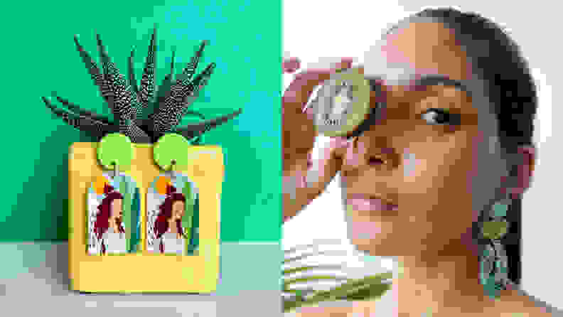 A pair of earrings on a plant next to a woman holding fruit next to her eye wearing earrings