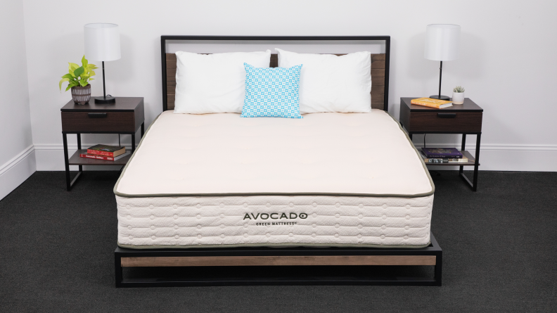 The Avocado Green Mattress between two bedside tables.