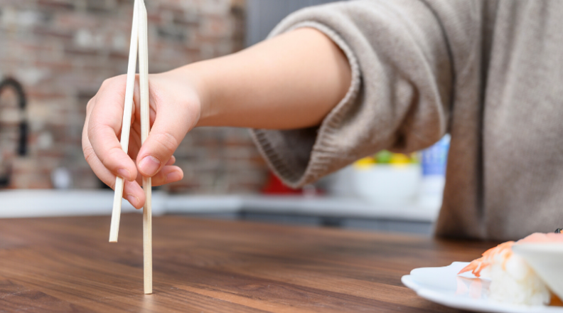 How to use chopsticks: tap them on the table to align.