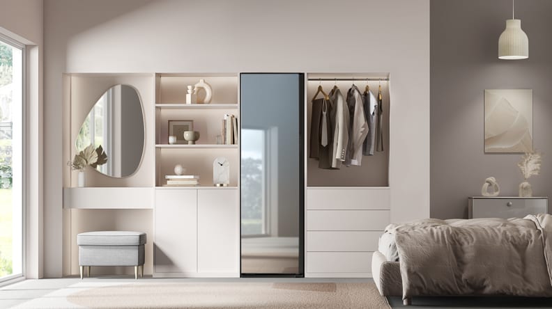 Samsung airdresser, set in a modern bedroom.  You can see its mirror finish reflecting light from a window.