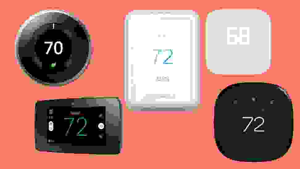 Three black and two white smart thermostats sit on an orange background