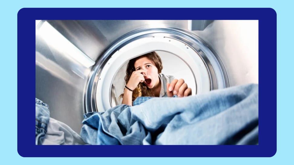A photo of a woman leaning into her washing machine and holds her nose against a blue background.