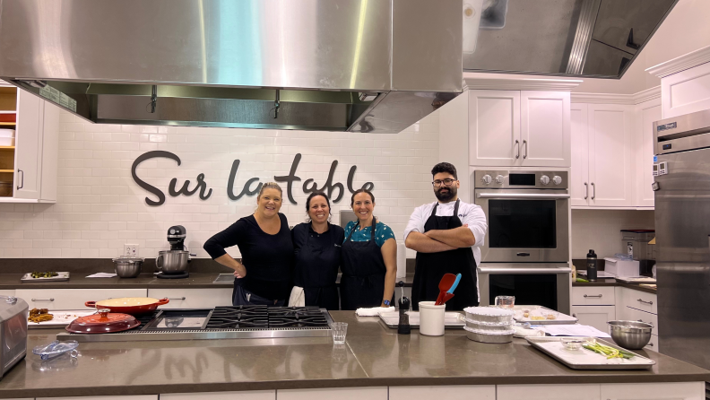People standing in the Sur La Table kitchen in Natick, MA.