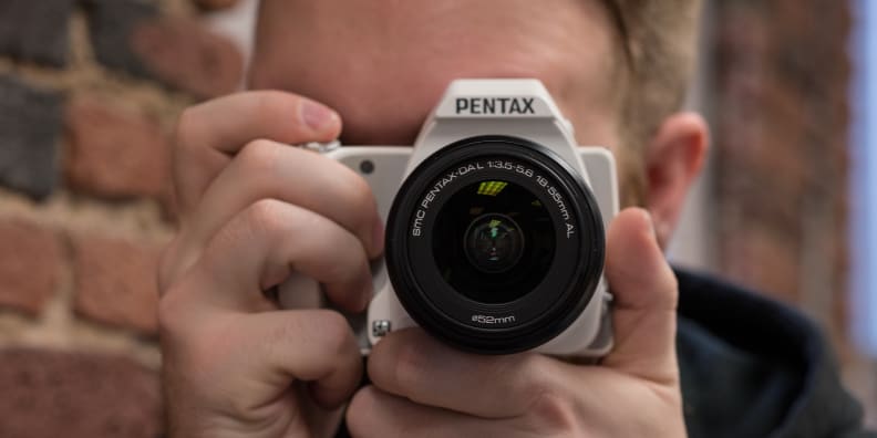 A photograph of the Pentax K-S1 in use.