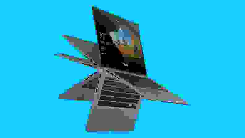A folding laptop against a blue background.
