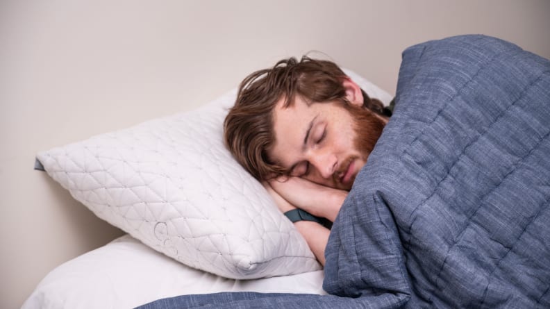 a man sleeps on the coop home goods pillow