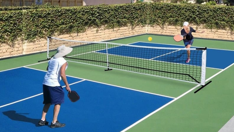 Two people on pickleball court playing a set