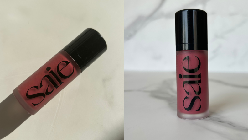 Saie Beauty Dew Liquid blush against a marbled background.