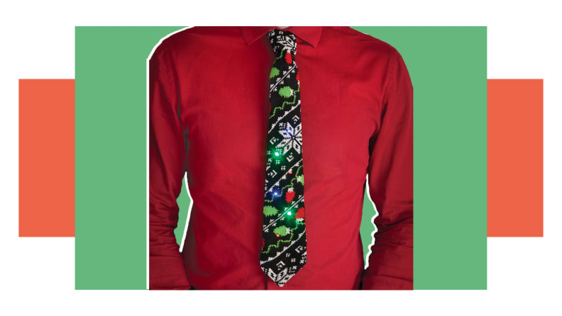 A man wearing a light up Christmas tie.