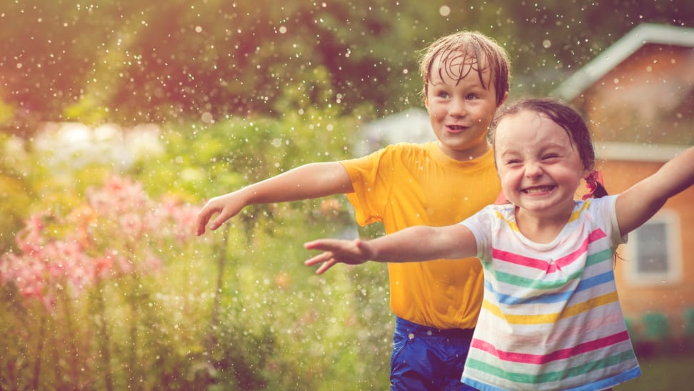 Kids playing in sprinkler