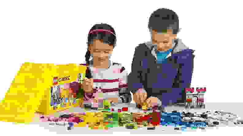 Two kids playing with Legos