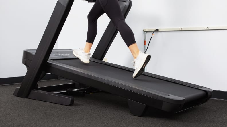 A person running on an inclined treadmill.