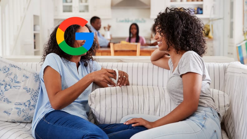 Two women talking but one of their heads is the Google logo