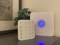 The Ring Alarm System keypad and home base station sit on a grey stand.