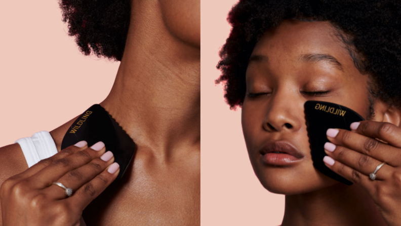 A woman using a stone to smooth skin.