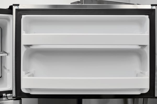 The GE GAS18P's freezer door offers some additional storage. It's fairly shallow, but should help keep track of smaller or loose items.