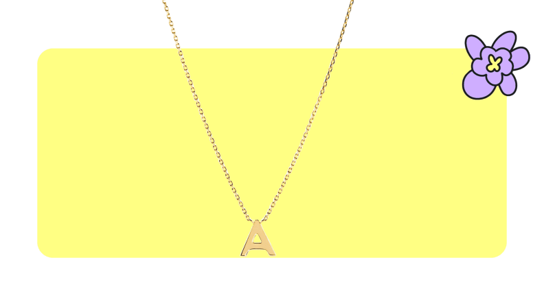 A gold pendant necklace from Mejuri with the letter A as the pendant.