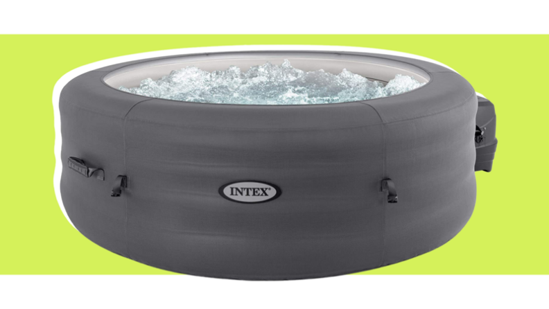 Gray inflatable hot tub pool filled with water.