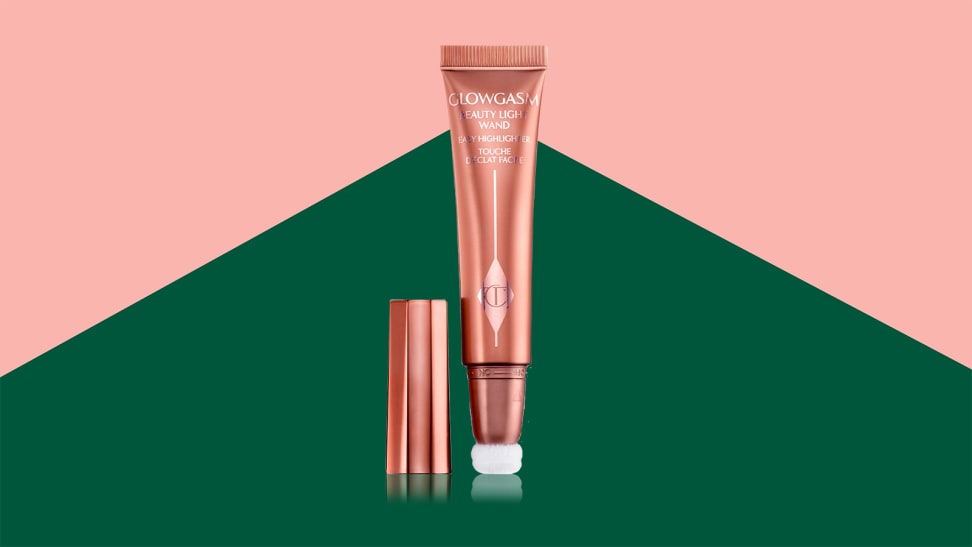 A pink tube of blush on a green and pink background.