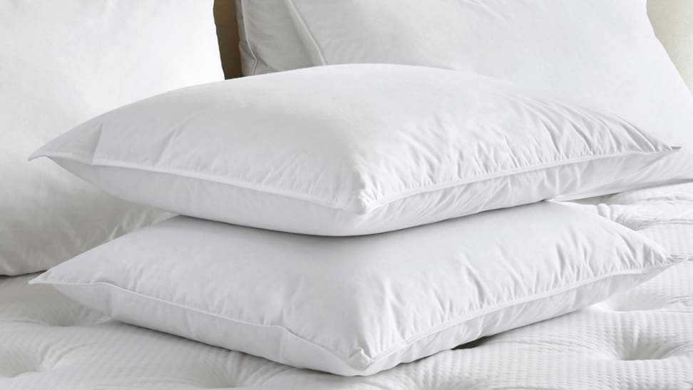 Two Marriott Pillows on a bed.