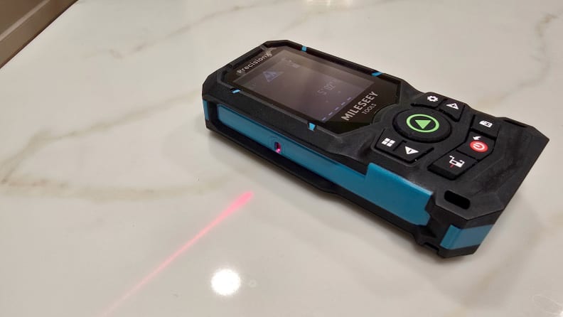 A laser level sits on a counter