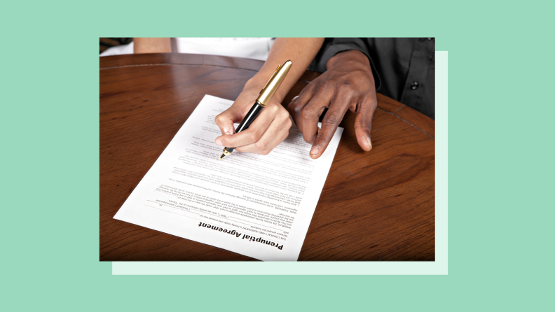 A stock photo of a hand signing a contract, set against a green background.