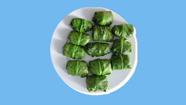 A filled plate of a traditional Jewish-Tunisian dish consisting of meat-stuffed romaine lettuce wrap