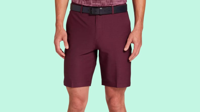 An image of a pair of wine-red, nine-inch inseam chino golf shorts.