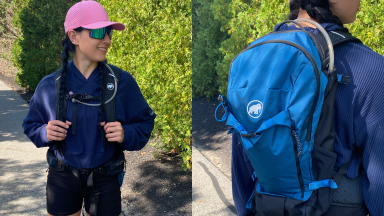 A person wears the  Mammut Lithium 20 Backpack while displaying the front and back outdoors.