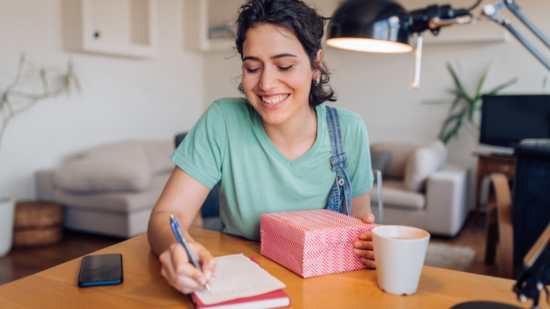 Woman putting together care package.