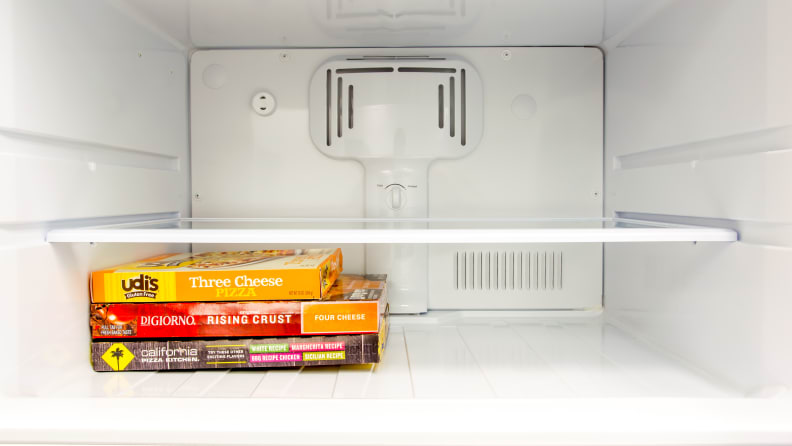 The freezer compartment of a GE top freezer refrigerator