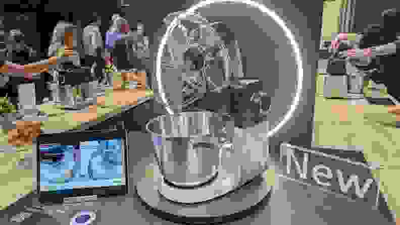 A stand mixer shown next to a tablet to showcase it's smart capabilities.
