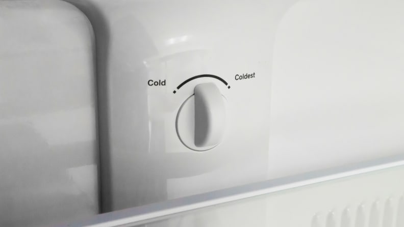 Temperature adjustment knobs inside a GE refrigerator