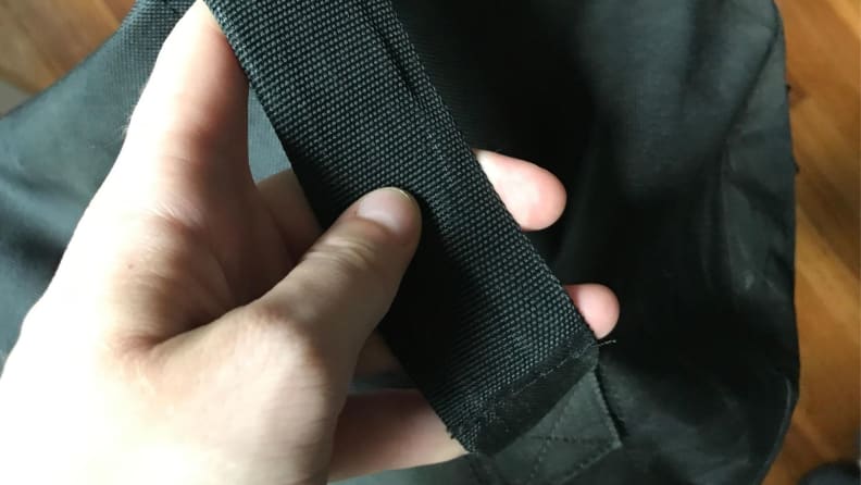 a hand holds the tempur-pedic packaging handle