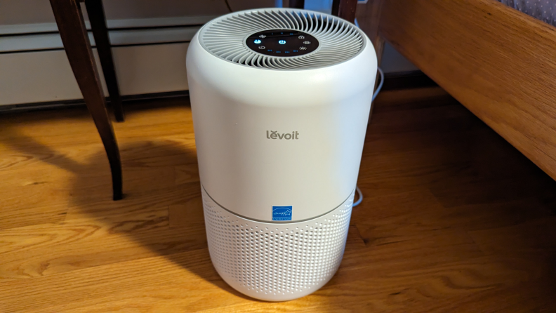 The front of the Levoit Core 300 air purifier stood up on a floor.