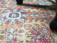 An office chair on top of the Boutique Rug.
