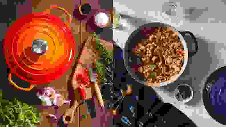 On left, orange dutch oven on a countertop surrounded by food. On right, blue dutch oven with lid removed revealing gumbo.