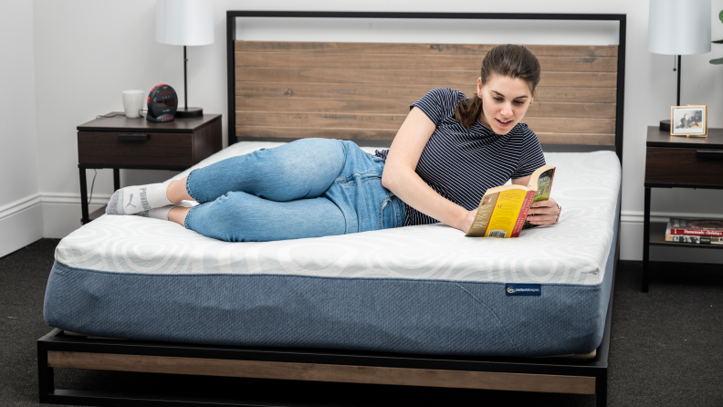 Woman reading on the Serta Perfect Sleeper Mattress