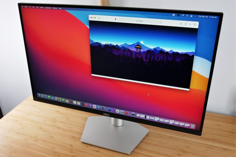 A computer monitor on a desk.