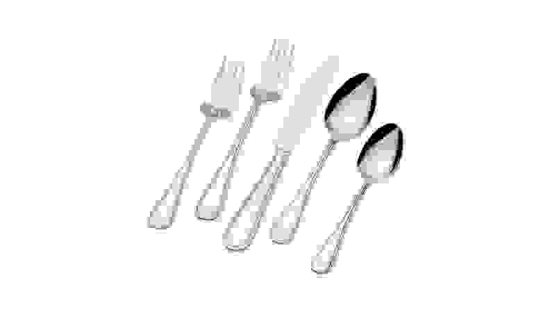 A 5-piece set of stainless steel flatware against a white background.